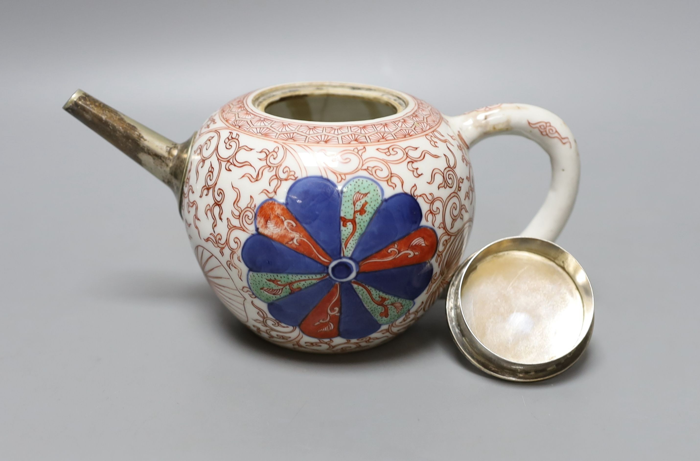 A Chinese Kangxi white metal-mounted porcelain teapot 19cm long